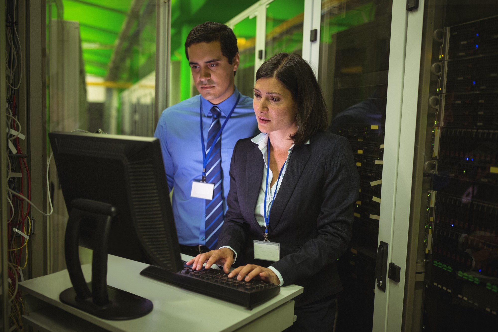 Man and Woman Checking a Computer